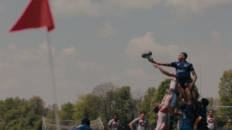 The Knights rugby team tips the ball. Film still from The Rugby Boys of Memphis. (Screenshot)